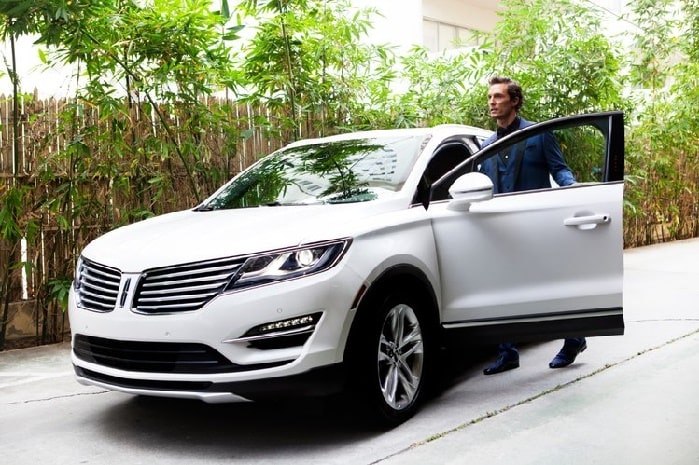 Matthew entering in his car
